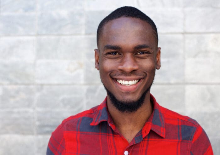 Happy young man smiling microthin veneers shippensburg pa